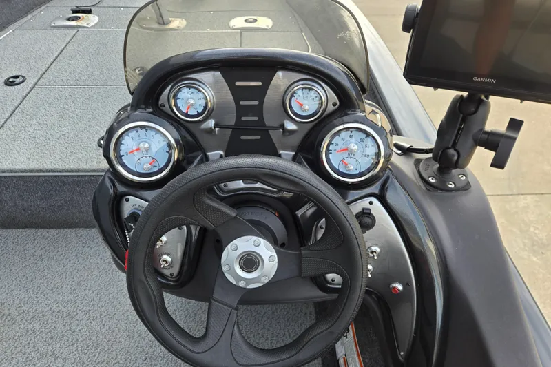 Slide: The Image of 2019 Tracker Pro Team 175 TF boat dashboard with steering wheel and gauges. - 60