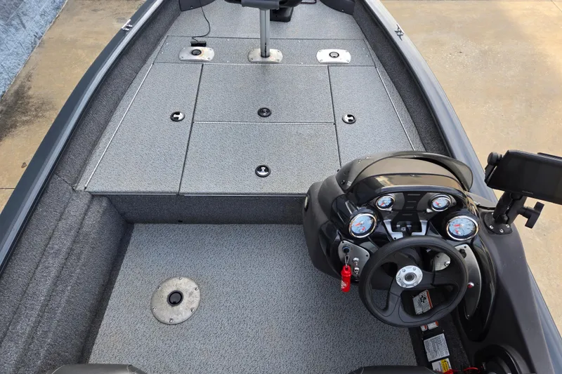Slide: The Image of 2019 Tracker Pro Team 175 TF boat interior with steering console and seating area. - 62