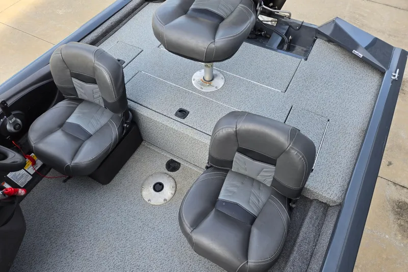 Slide: The Image of 2019 Tracker Pro Team 175 TF boat interior with three gray seats. - 67