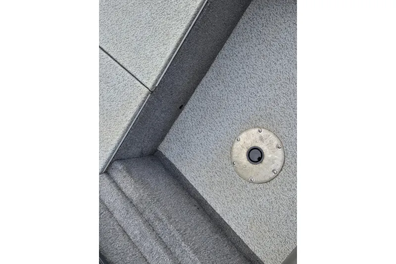 Slide: The Image of Carpeted deck of 2019 Tracker Pro Team 175 TF boat with metal fixture. - 68