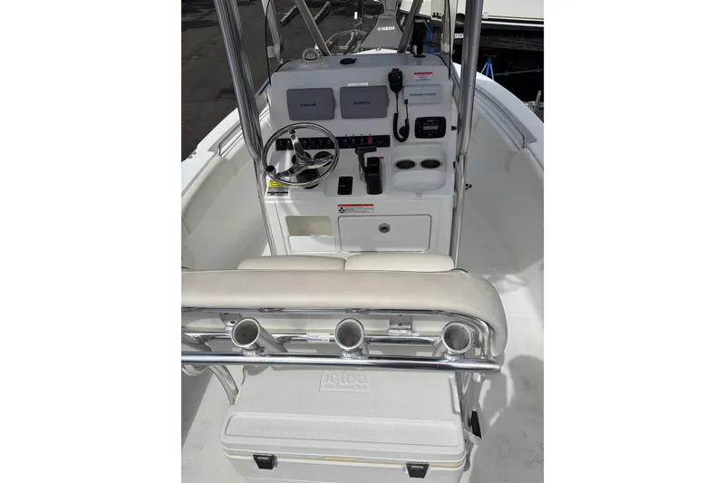 Slide: The Image of 2015 Sea Hunt Ultra 196 boat console with steering wheel and controls. - 11