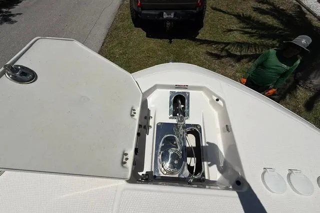 Slide: The Image of 2019 Robalo R272 Center Console boat anchor compartment, open lid, viewed from above. - 16