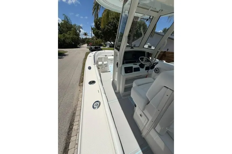 Slide: The Image of 2019 Robalo R272 Center Console boat with sleek design and modern cockpit features. - 17