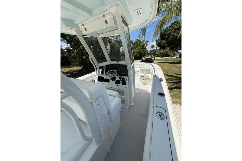 Slide: The Image of 2019 Robalo R272 Center Console boat interior with helm and seating. - 18