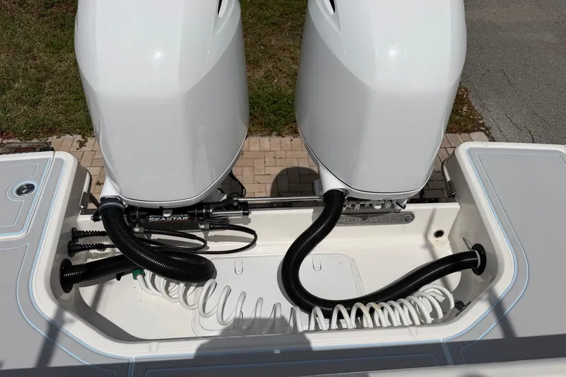 Slide: The Image of 2019 Robalo R272 Center Console boat with dual outboard engines and SeaStar steering system. - 20