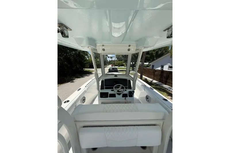 Slide: The Image of 2019 Robalo R272 Center Console boat interior with steering wheel and seating. - 3