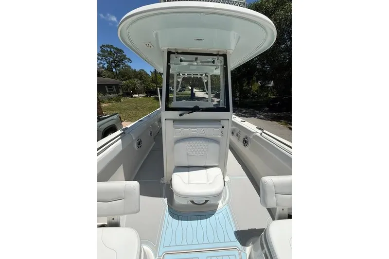 Slide: The Image of 2019 Robalo R272 Center Console boat interior with seating and console view. - 7