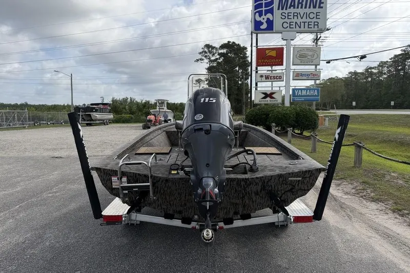 Slide: The Image of 2026 Xpress H190B Bay boat on trailer at marine service center. - 13