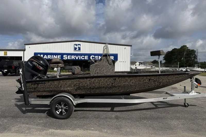 Slide: The Image of 2026 Xpress H190B Bay boat on trailer at Marine Service Center. - 6