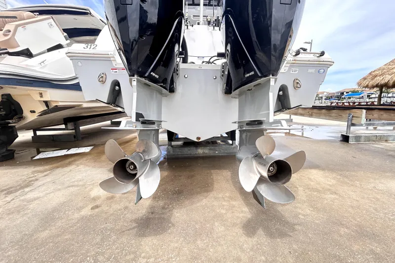 Slide: The Image of 2024 Sea Fox 328 Commander boat with dual outboard engines and propellers. - 4