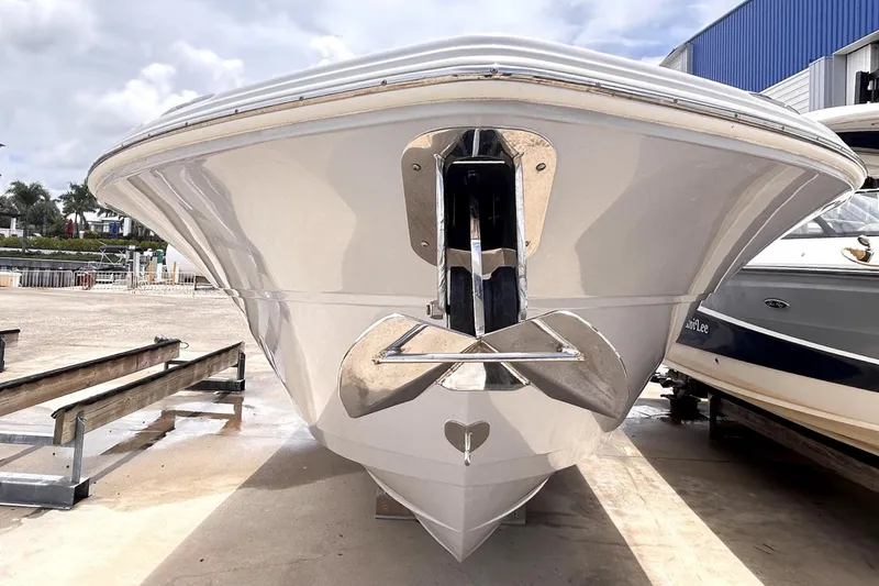 Slide: The Image of 2024 Sea Fox 328 Commander boat in a marina, under a cloudy sky. - 8