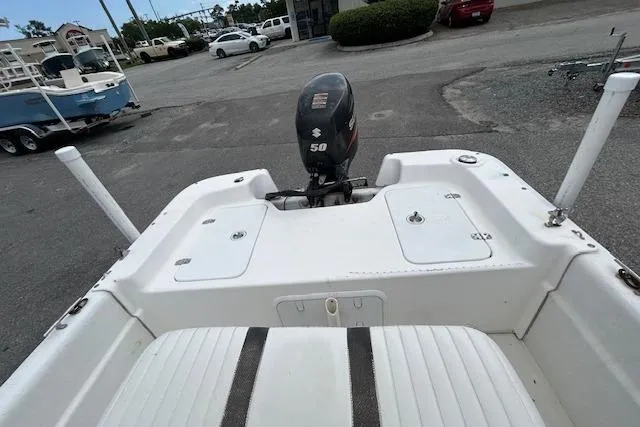 Slide: The Image of 2011 Carolina Skiff JVX16CC boat with 50 HP outboard motor, parked in a lot. - 6
