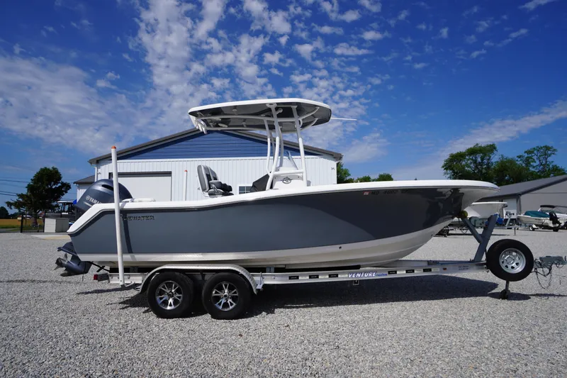 The Image of 2020 Tidewater 220 LXF boat on trailer under clear blue sky. - 0