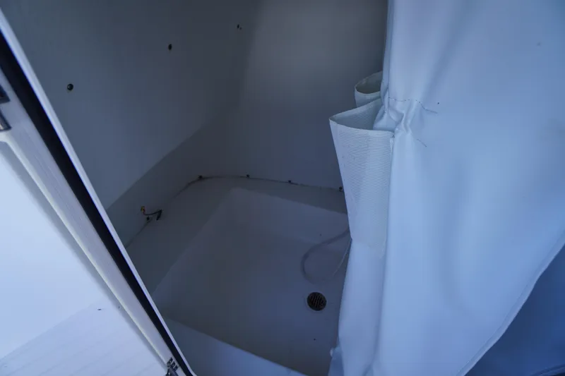 Slide: The Image of Interior view of 2020 Tidewater 220 LXF boat compartment with curtain. - 11