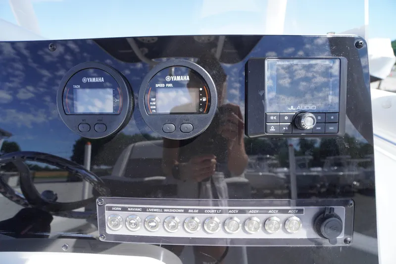 Slide: The Image of Dashboard of 2020 Tidewater 220 LXF with Yamaha gauges and JL Audio system. - 14