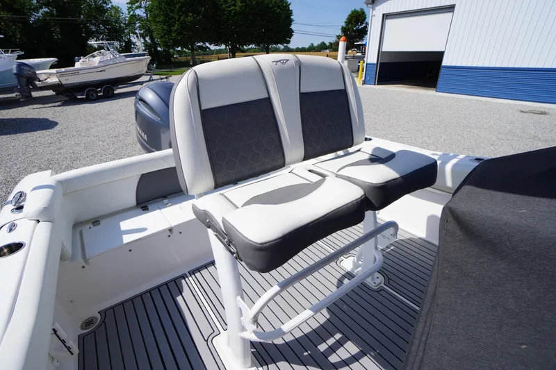 Slide: The Image of 2020 Tidewater 220 LXF boat interior with dual seating and sleek design. - 19