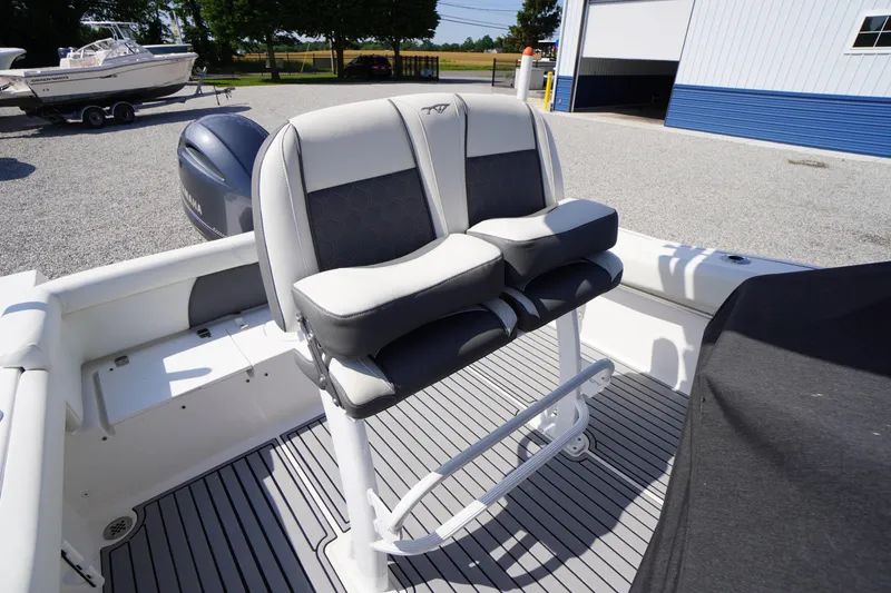 Slide: The Image of 2020 Tidewater 220 LXF boat with dual cushioned seats and Yamaha engine. - 21