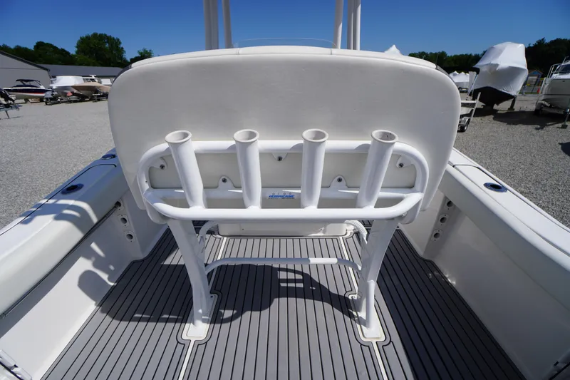Slide: The Image of 2020 Tidewater 220 LXF boat interior with rod holders and sleek flooring. - 22