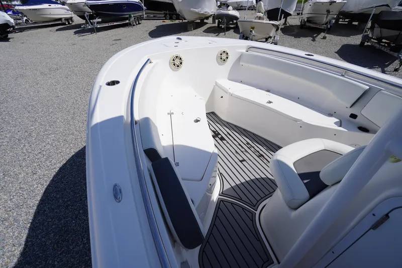 Slide: The Image of 2020 Tidewater 220 LXF boat interior with seating and deck, displayed outdoors. - 3