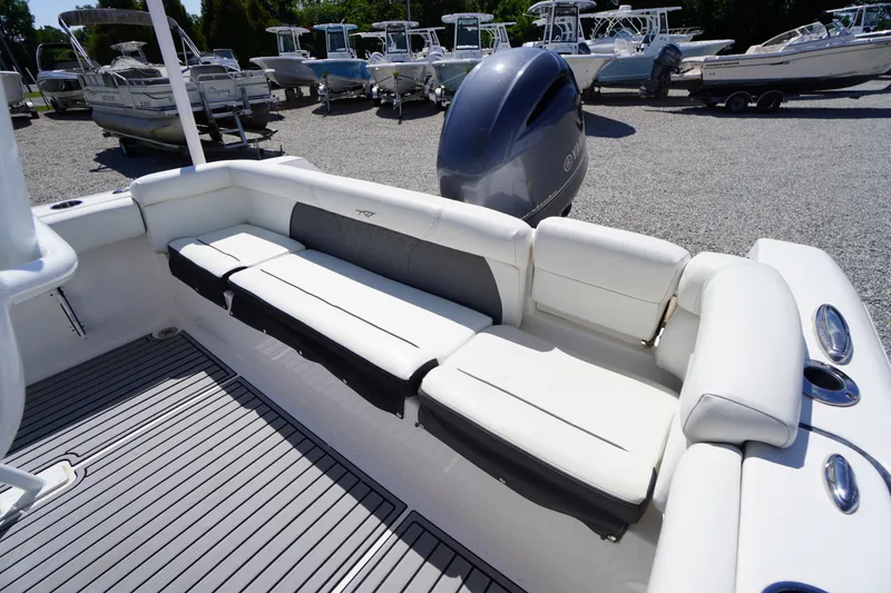 Slide: The Image of 2020 Tidewater 220 LXF boat interior with white seating and Yamaha outboard engine. - 31