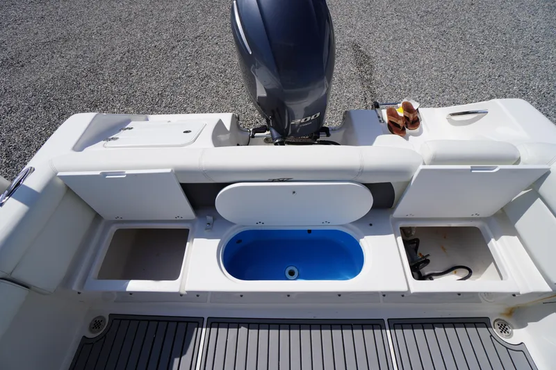 Slide: The Image of 2020 Tidewater 220 LXF boat stern with storage compartments and Yamaha outboard motor. - 32