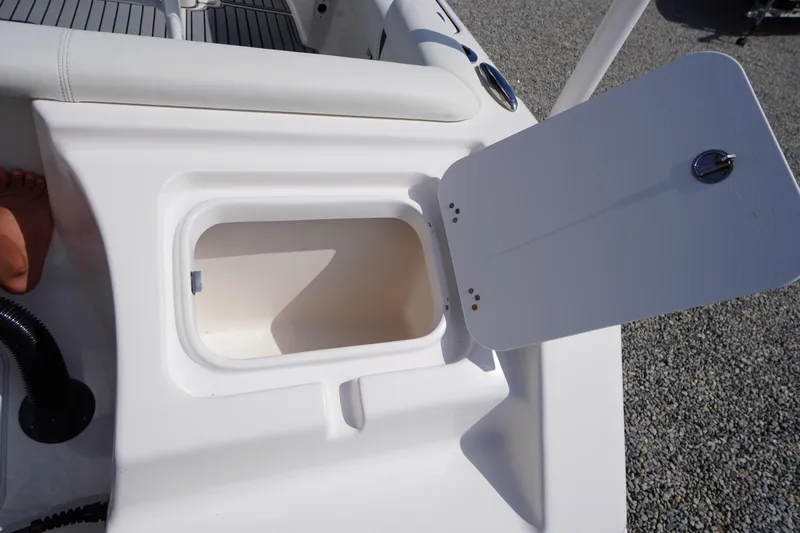 Slide: The Image of Open storage compartment on a 2020 Tidewater 220 LXF boat, showing interior details. - 35