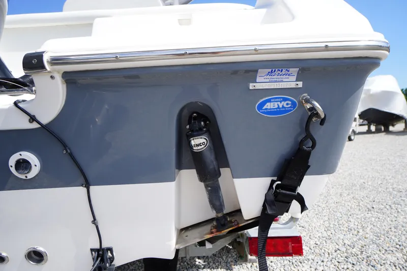 Slide: The Image of 2020 Tidewater 220 LXF boat stern with ABYC member sticker and Lenco trim tab. - 38