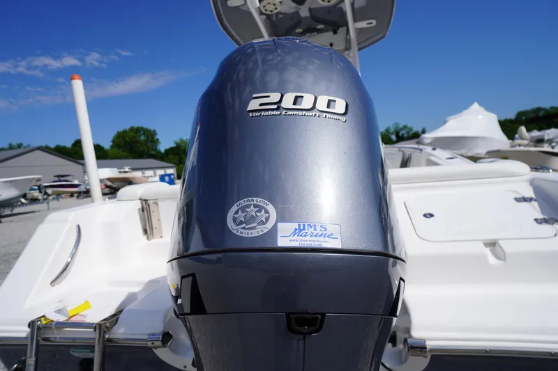 Slide: The Image of 2020 Tidewater 220 LXF boat with 200 horsepower engine, displayed outdoors. - 39