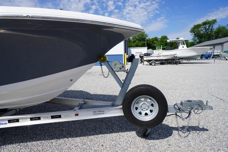 Slide: The Image of 2020 Tidewater 220 LXF boat on trailer in a gravel lot. - 43