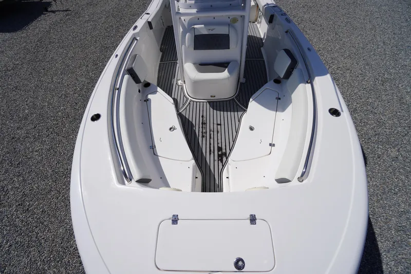 Slide: The Image of 2020 Tidewater 220 LXF boat interior with seating and storage compartments. - 5