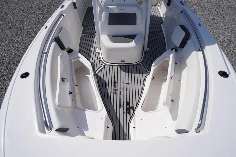 Slide: The Image of 2020 Tidewater 220 LXF boat interior with seating and storage compartments. - 6