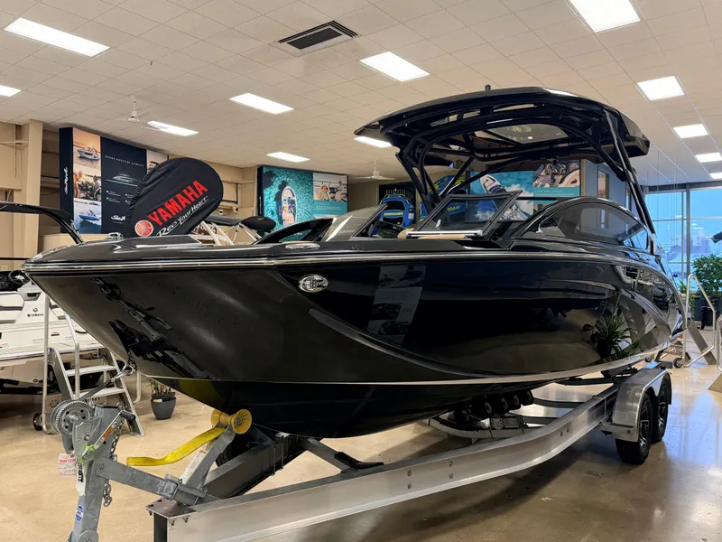 Slide: The Image of 2026 Yamaha Boats 275 SD displayed in a showroom. - 2