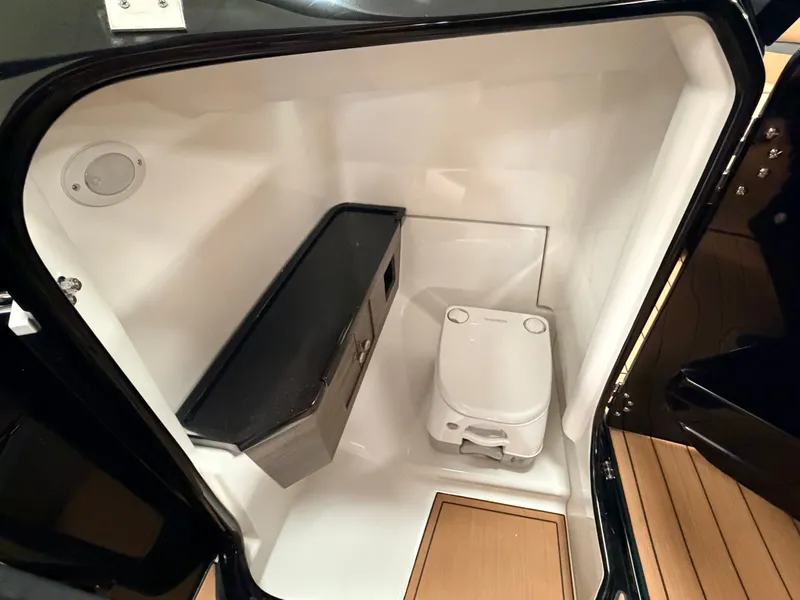 Slide: The Image of Interior of 2026 Yamaha Boats 275 SD featuring a toilet. - 9