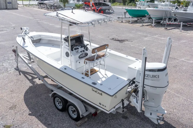 Slide: The Image of 2004 Sea Craft 23 CC boat with Suzuki outboard motor on trailer. - 11