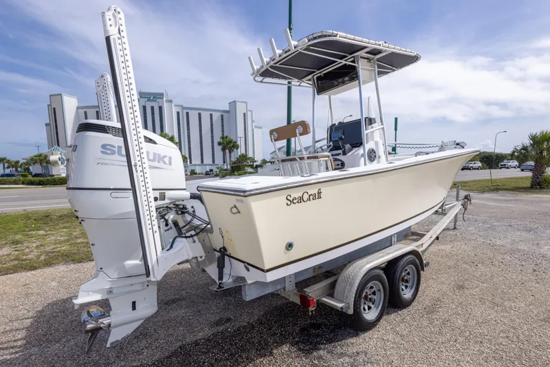 Slide: The Image of 2004 Sea Craft 23 CC boat on trailer with Suzuki outboard motor. - 12