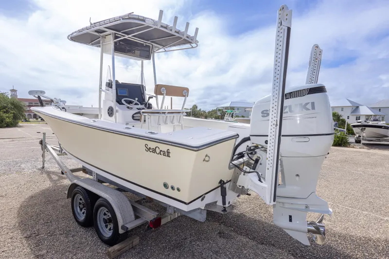Slide: The Image of 2004 Sea Craft 23 CC boat on trailer with Suzuki outboard motor. - 14