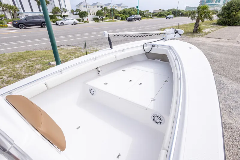 Slide: The Image of 2004 Sea Craft 23 CC boat interior with white seating and storage compartments. - 24