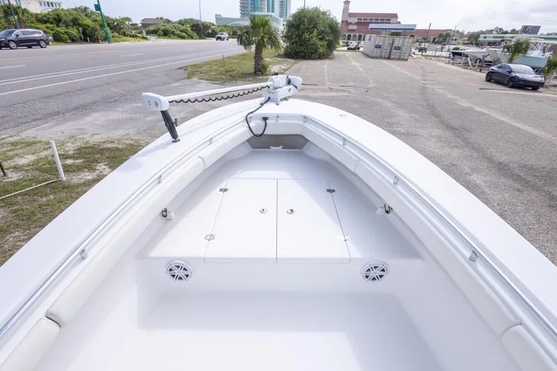 Slide: The Image of 2004 Sea Craft 23 CC boat bow view, featuring spacious deck and storage compartments. - 27