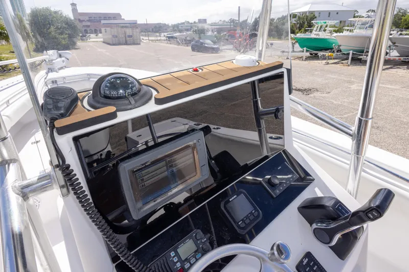 Slide: The Image of 2004 Sea Craft 23 CC boat console with navigation equipment and controls. - 36