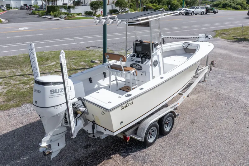 Slide: The Image of 2004 Sea Craft 23 CC boat on trailer with Suzuki outboard motor. - 39