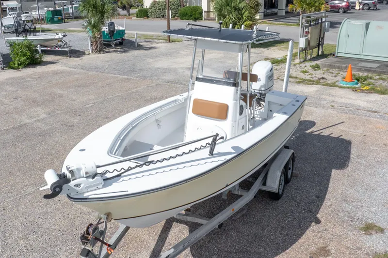 Slide: The Image of 2004 Sea Craft 23 CC boat on trailer in outdoor setting. - 4