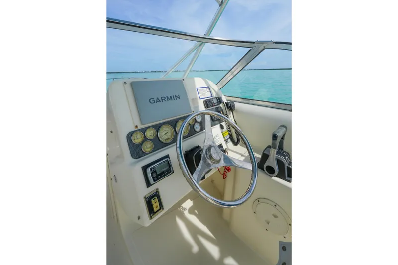 Slide: The Image of Helm of 2006 World Cat 250 DC boat with Garmin navigation system and ocean view. - 11