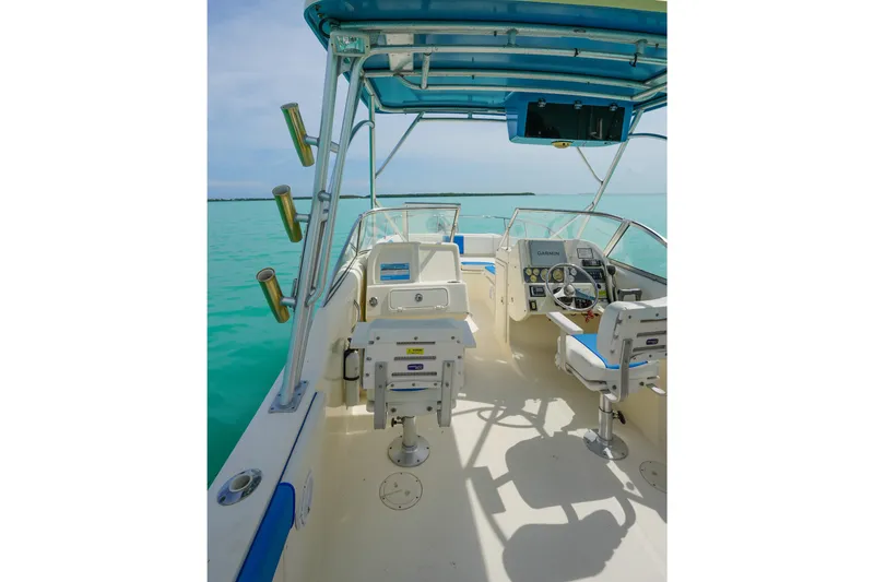 Slide: The Image of 2006 World Cat 250 DC boat interior with helm, seats, and ocean view. - 15