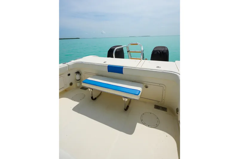 Slide: The Image of 2006 World Cat 250 DC boat interior with blue bench, ocean view. - 25
