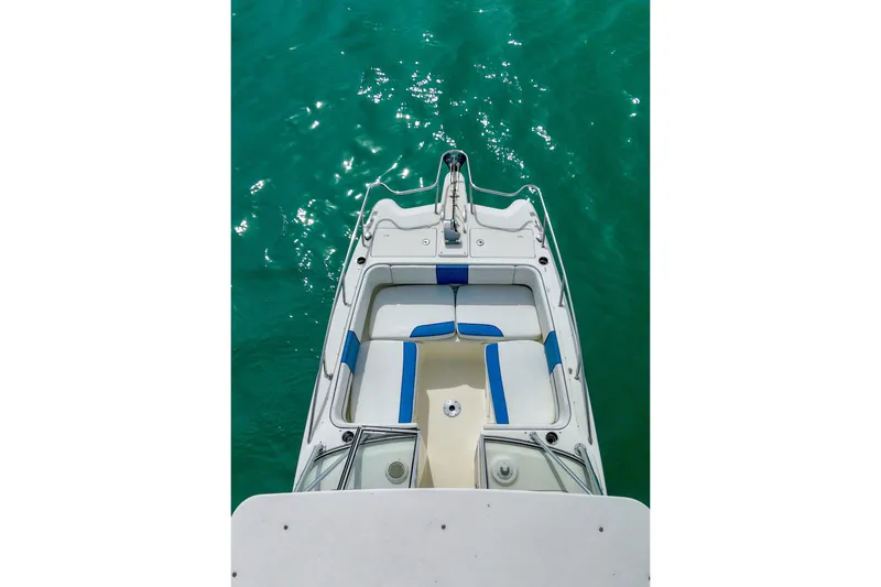 Slide: The Image of Overhead view of 2006 World Cat 250 DC boat on turquoise water. - 5