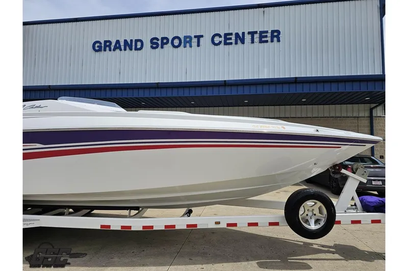 Slide: The Image of 2005 Baja 30 Outlaw boat on trailer at Grand Sport Center. - 12