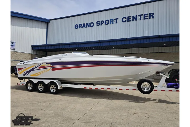 Slide: The Image of 2005 Baja 30 Outlaw boat on trailer at Grand Sport Center. - 13