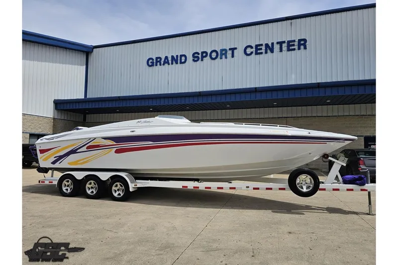 Slide: The Image of 2005 Baja 30 Outlaw boat on trailer at Grand Sport Center. - 14