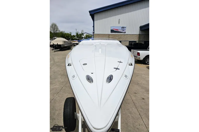 Slide: The Image of 2005 Baja 30 Outlaw boat on trailer outside a storage facility. - 17