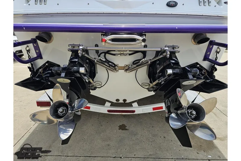 Slide: The Image of Rear view of a 2005 Baja 30 Outlaw boat with dual propellers. - 30